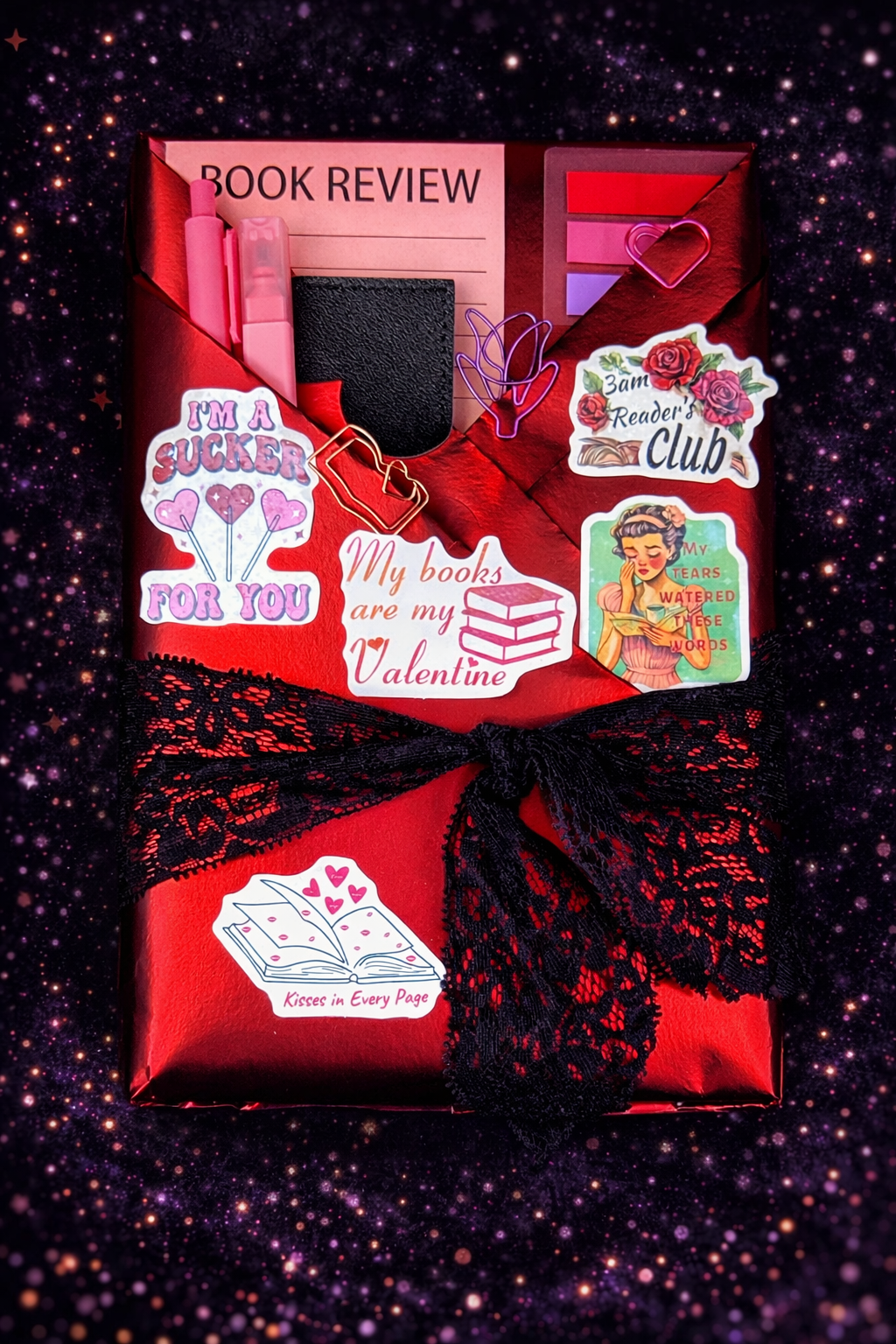 Book wrapped in dark sexy red paper and wrapped in a black lace ribbon. Perfect wrapping for your next dark romance novel with plenty of spice.